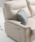 a couch with a pillow on it and a phone hooked up to it