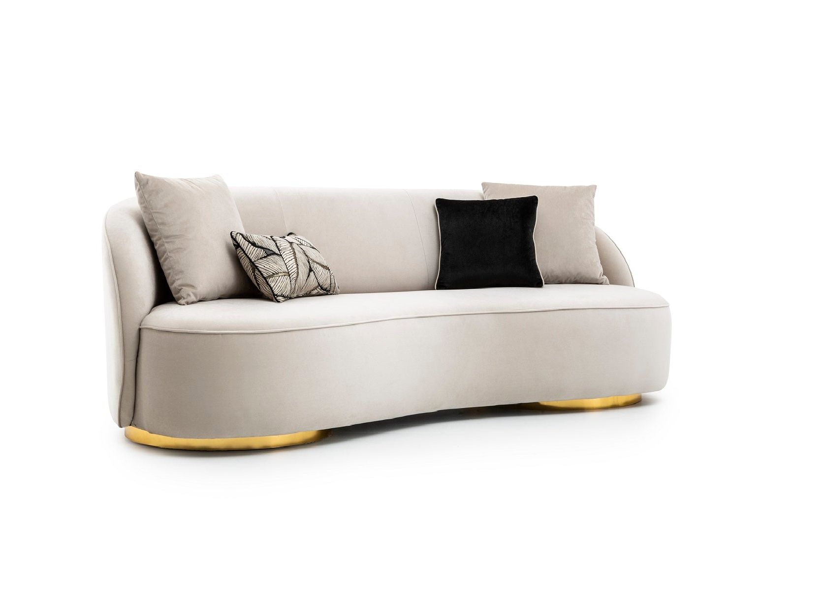 a white couch with black and gold pillows
