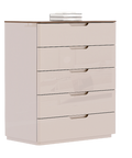 a white dresser with four drawers and a bottle on top of it