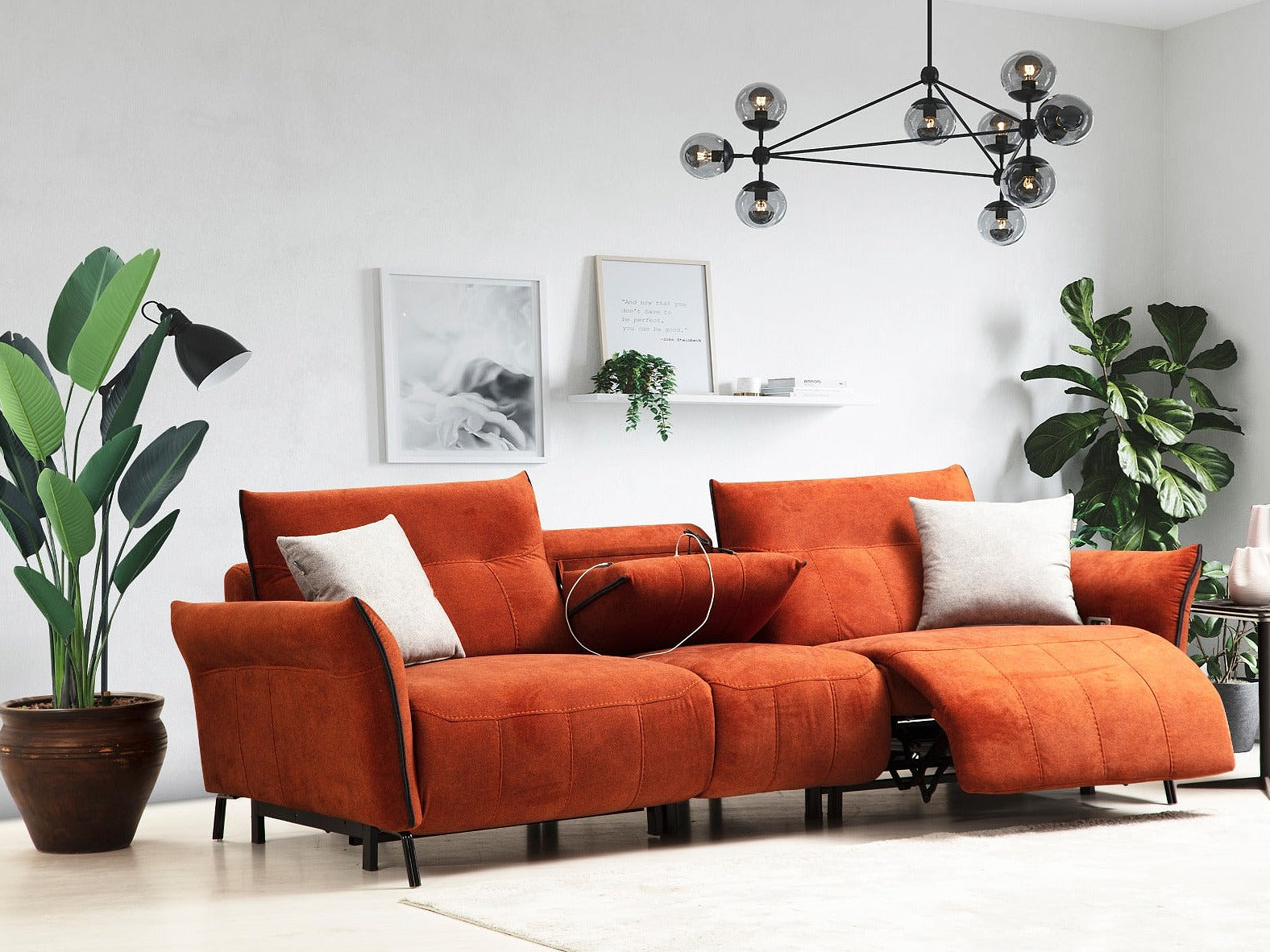 a living room with an orange couch and a potted plant
