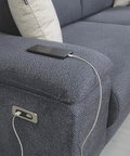 a couch with a cell phone hooked up to it