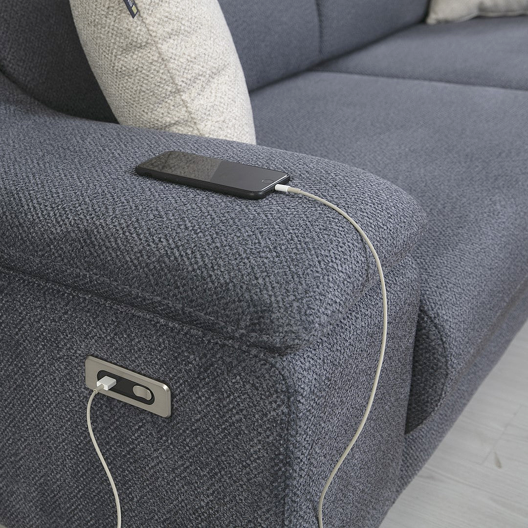 a couch with a cell phone hooked up to it