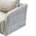 a white couch with two pillows on top of it