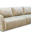 a beige couch with four pillows on top of it