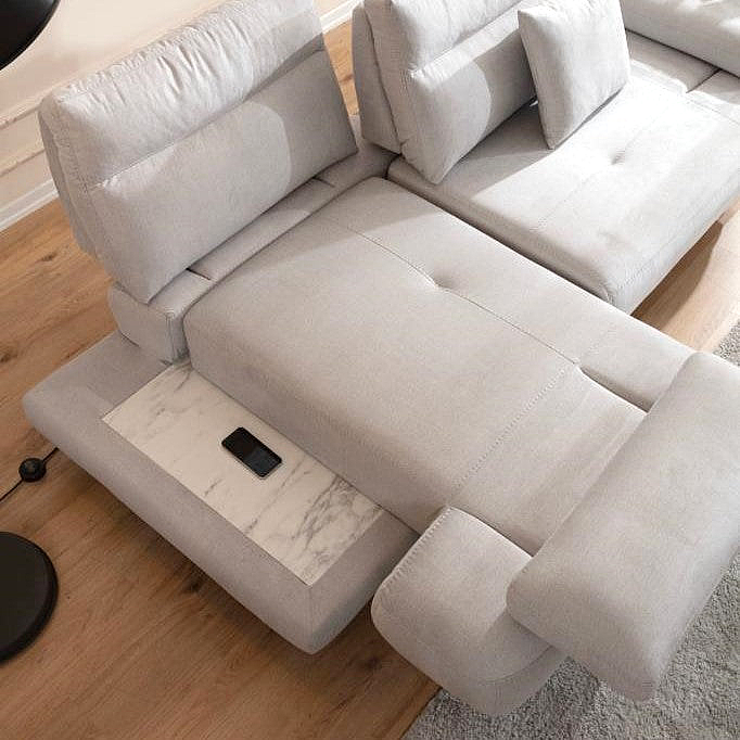 a couch with a recliner and a remote control