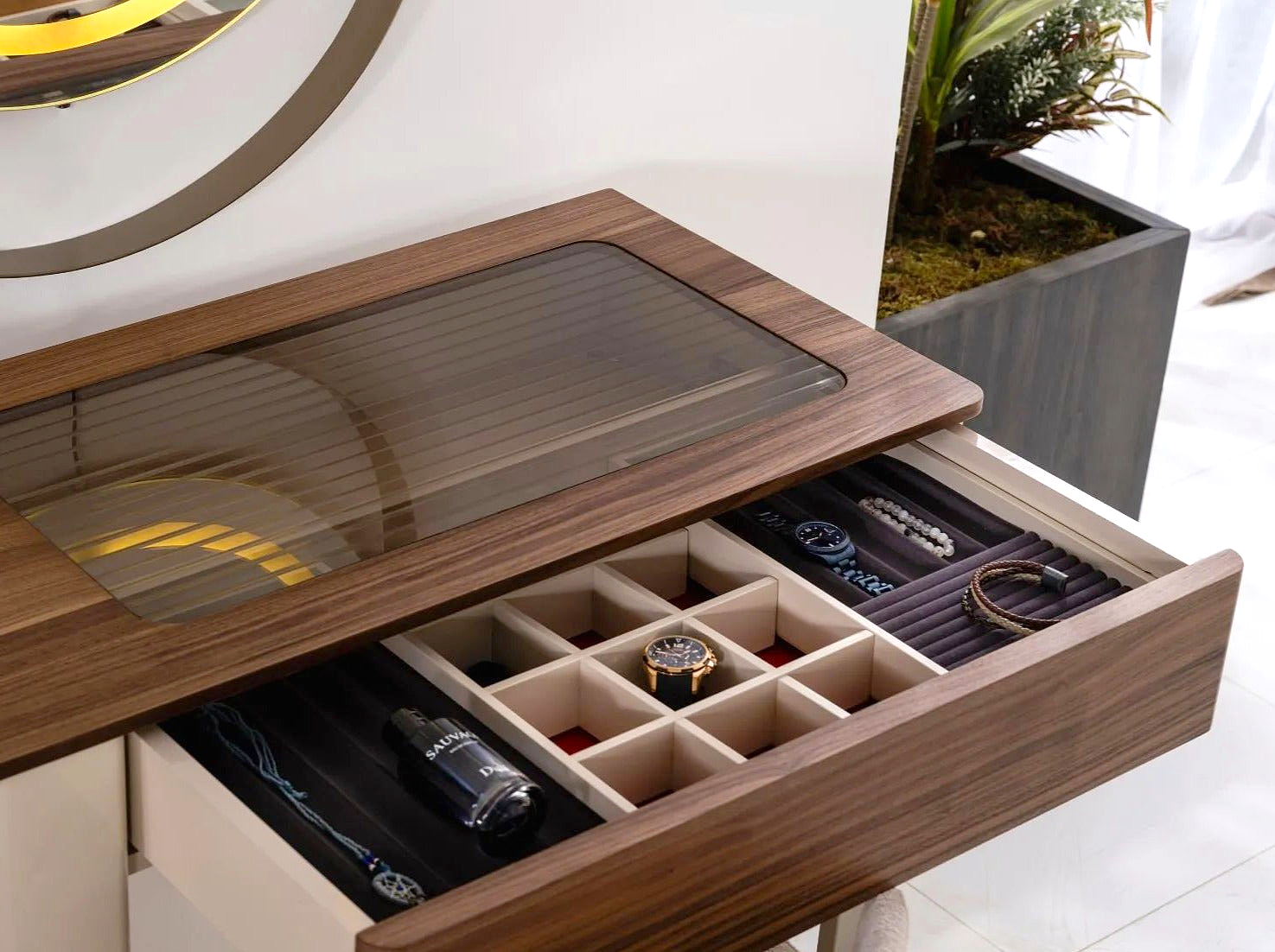 a wooden desk with a drawer containing watches and watches