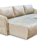 a white couch with two pillows on top of it